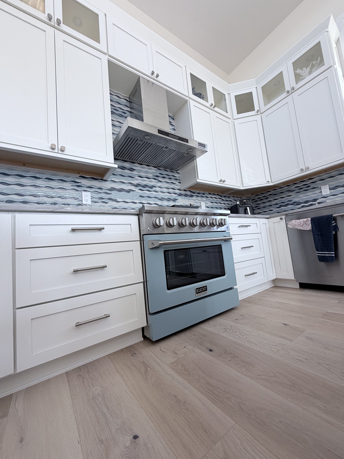 The finished kitchen with pale-blue range
