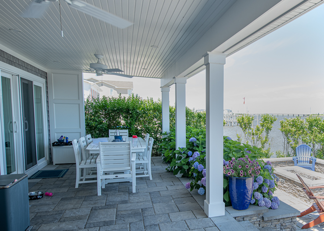The home’s covered porch and outdoor dining space