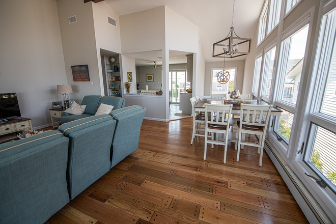 The same home’s open living and dining room