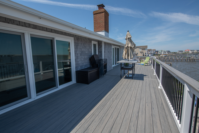 The same home’s upper deck overlooking the water