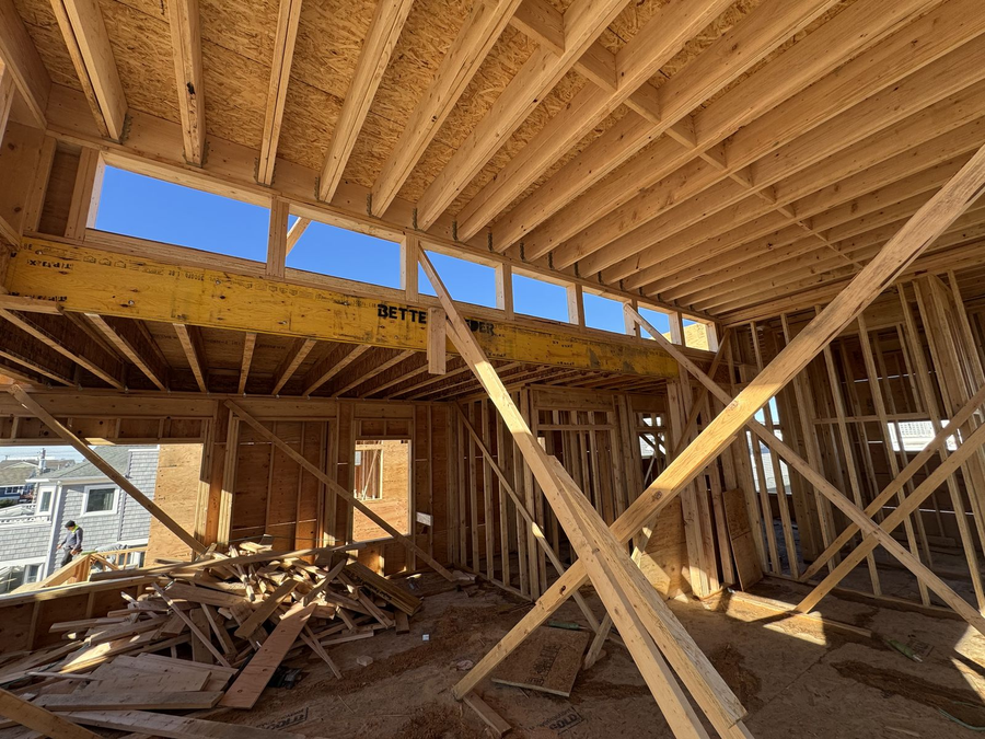 Framed interior with a heavy LVL beam and clerestory window openings
