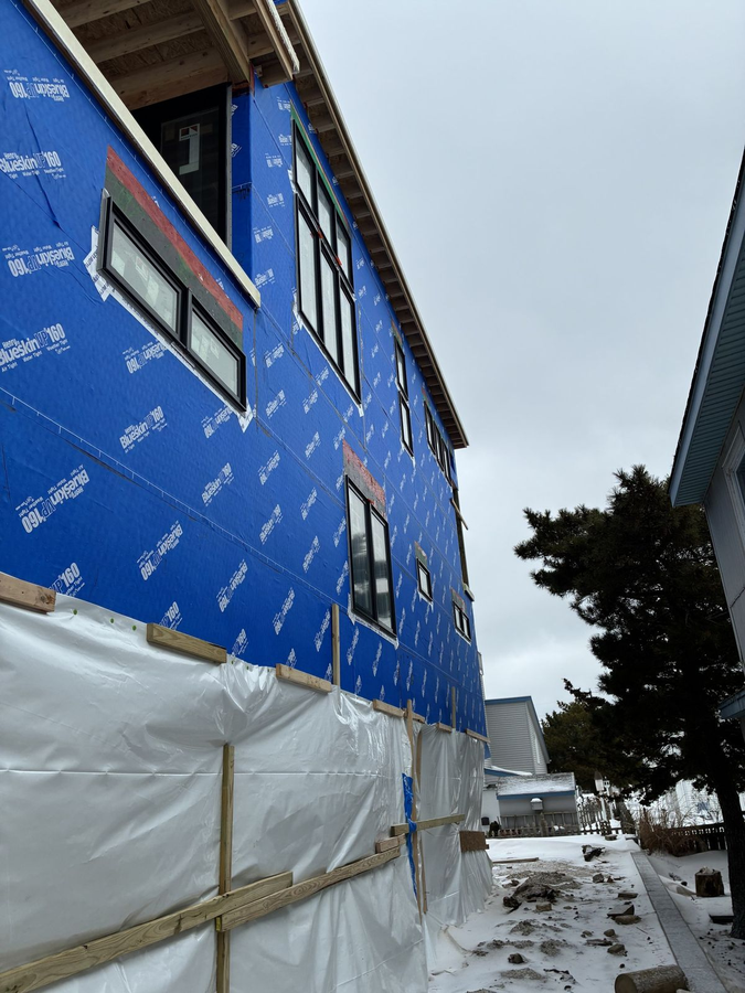Side elevation with windows installed and wrap taped