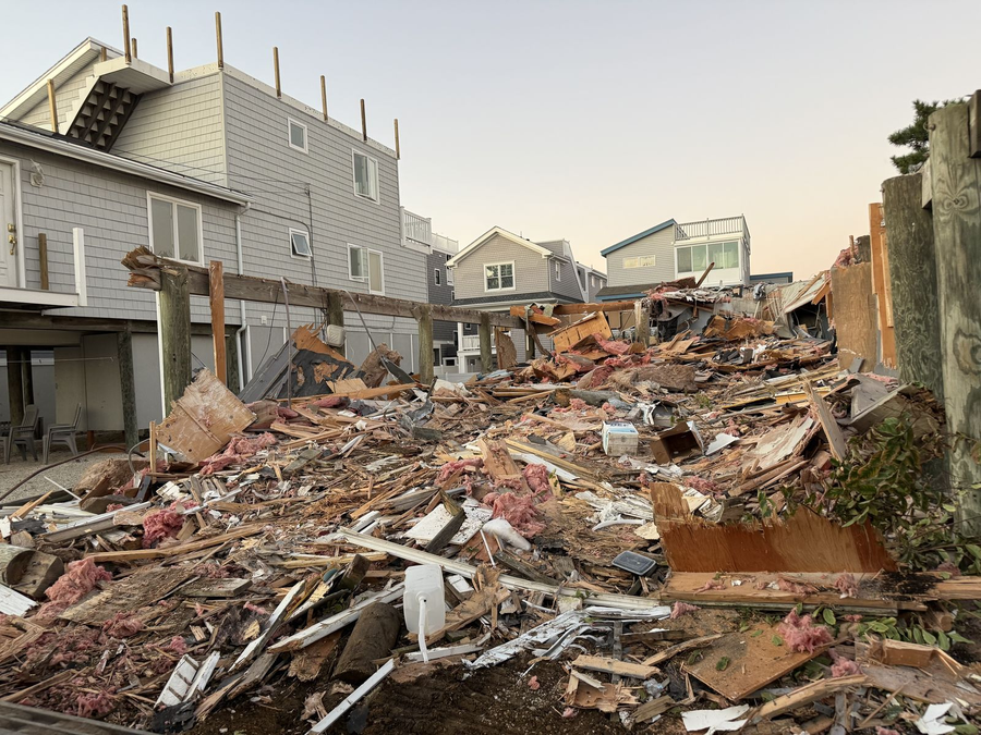 Demolition debris from the old house, staged for removal