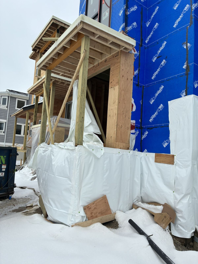Covered porch framing at the corner