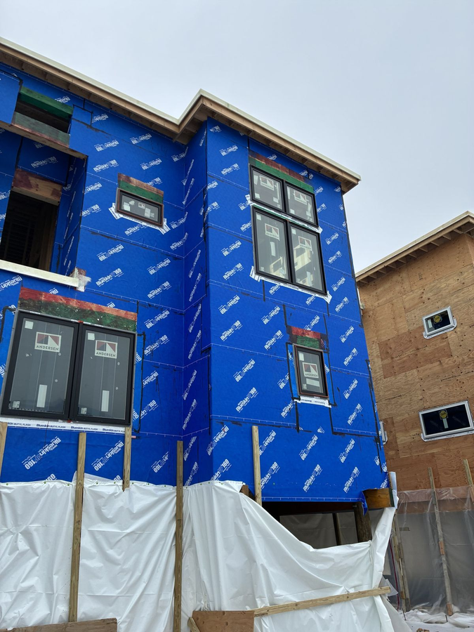 Front corner with window openings and sill details