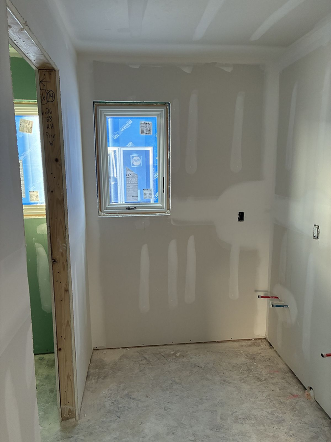 Bathroom drywall hung with a window opening