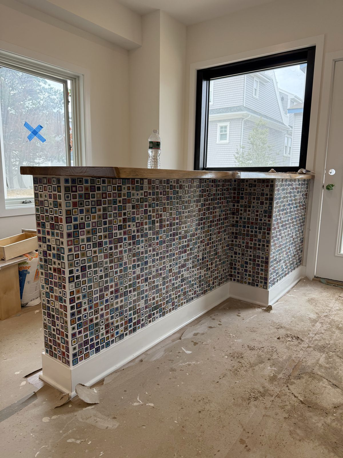 Mosaic glass tile bar with a live-edge wood top