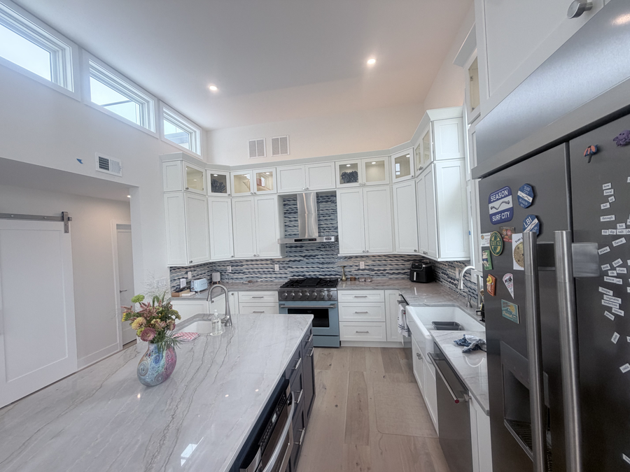 Kitchen with clerestory windows and stainless appliances