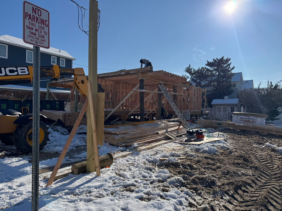 Framing under way after a snowfall
