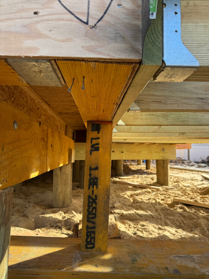 A post and girder connection from below