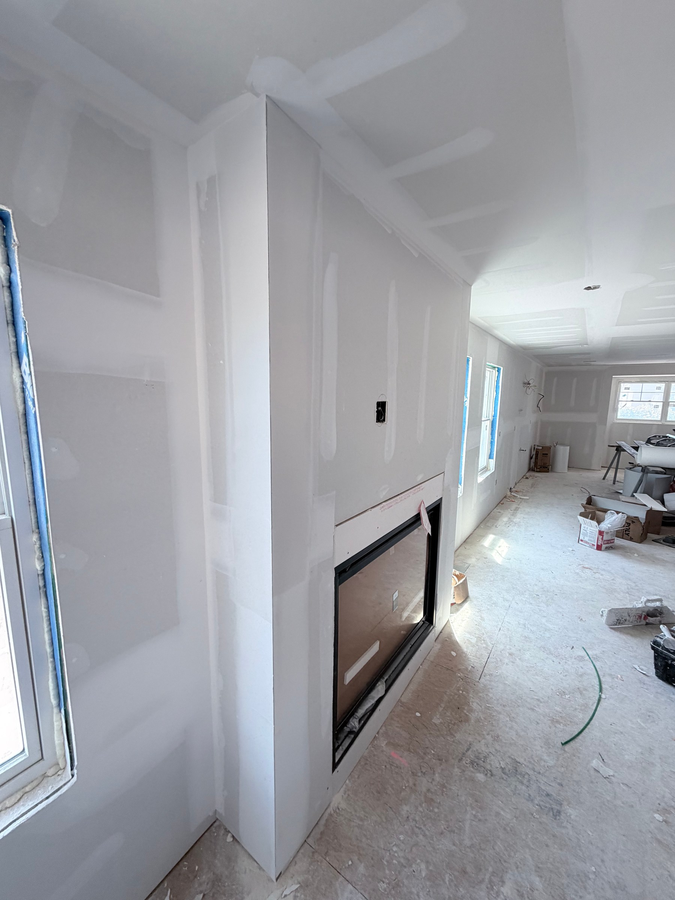Built-ins and the fireplace wall taking shape