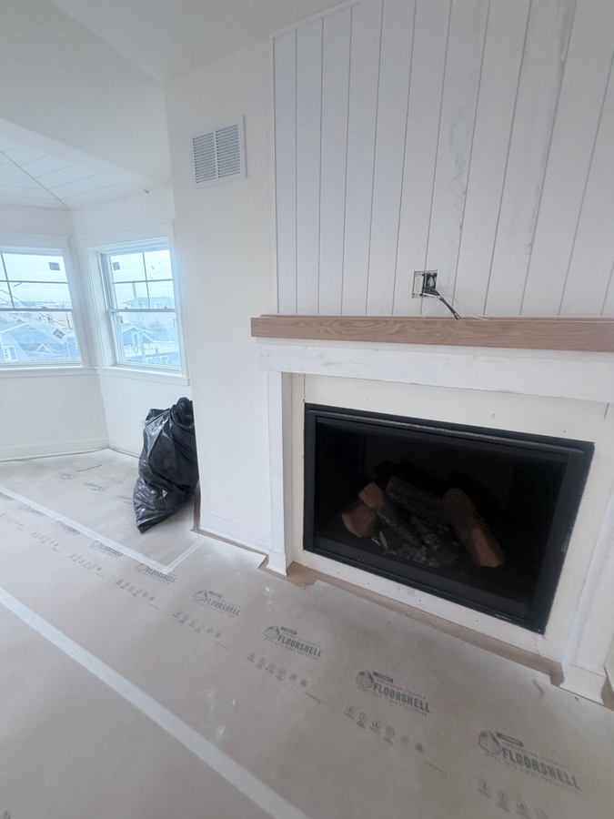 Fireplace with a shiplap wall