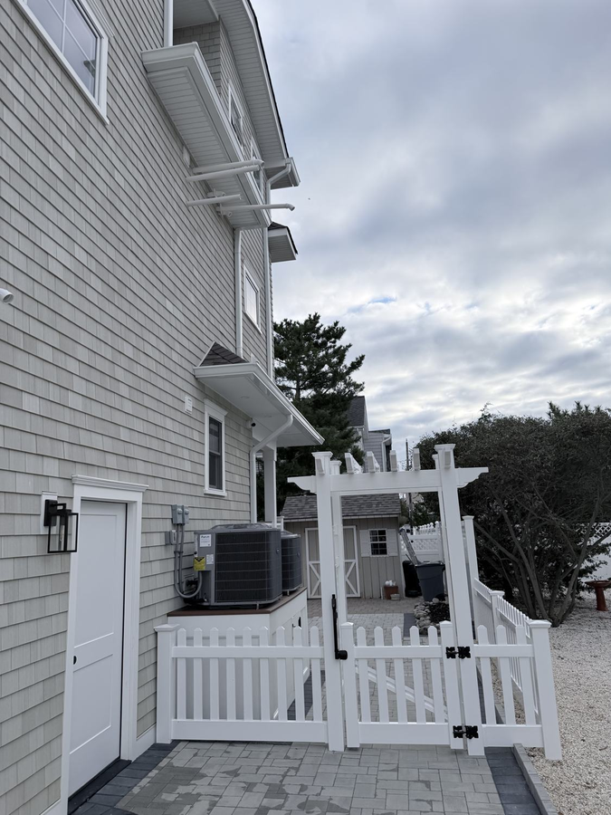 Side yard with a pergola gate