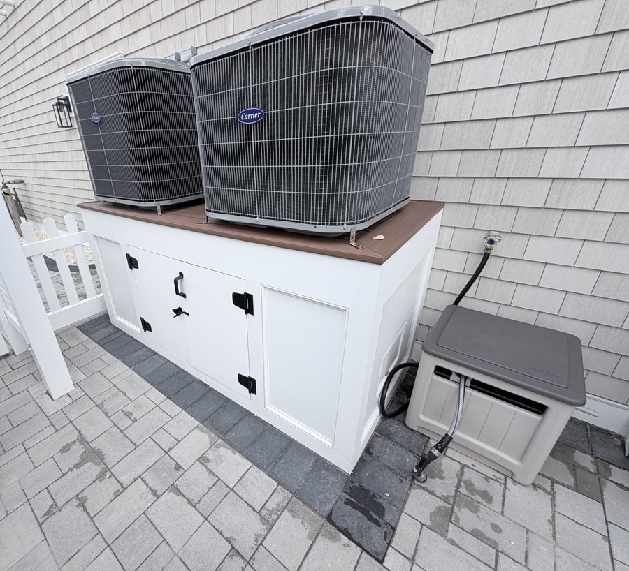 Carrier condensers on an enclosed cabinet stand
