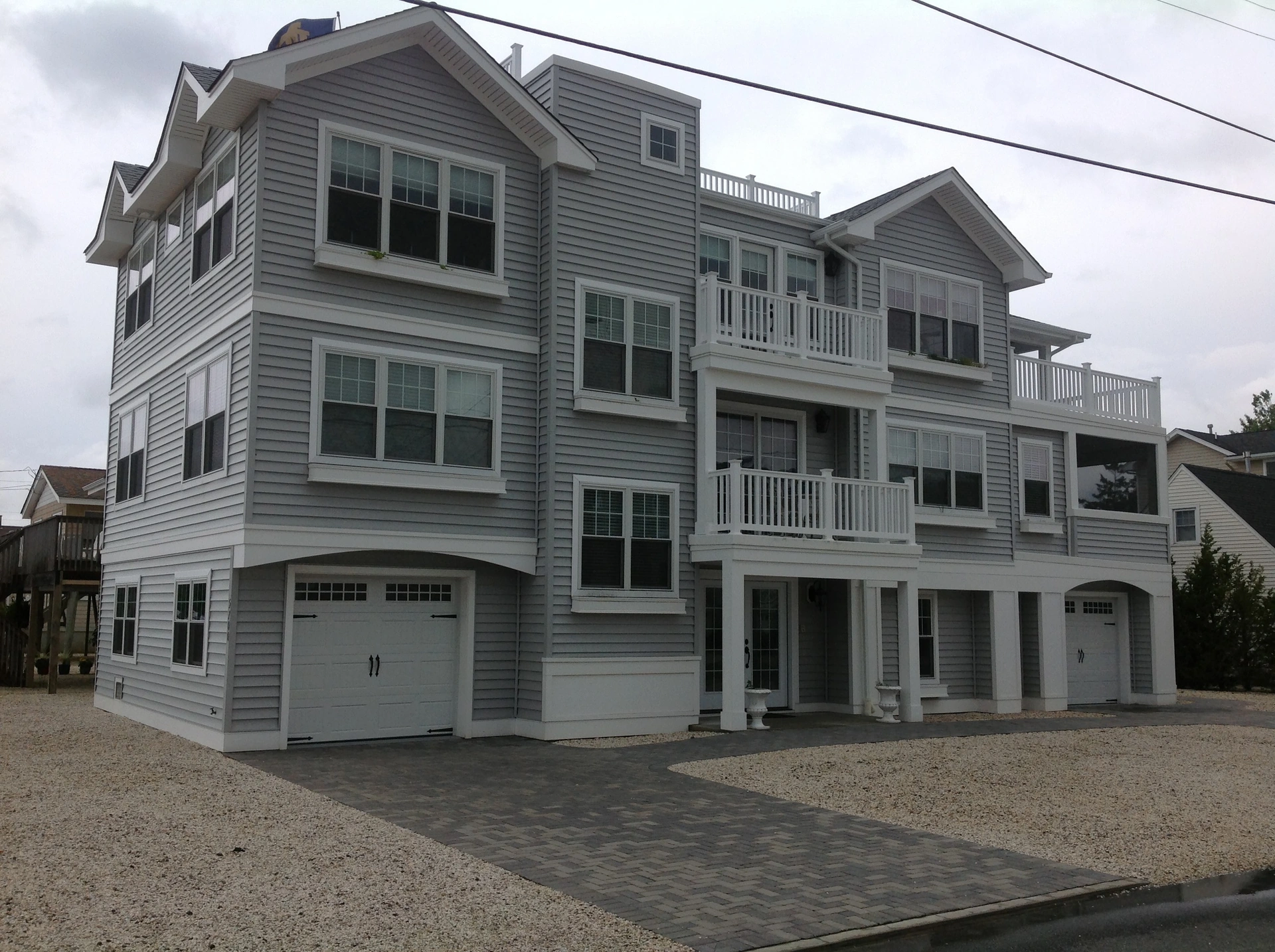 Finished coastal home with porches and decks